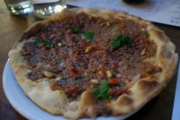 Armenian-style Lahmucan - Flatbread with spiced lamb, tomato, onion, peppers and pine kernels