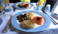 Crumpets with smoked salmon, scrambled eggs, mushrooms and caviar