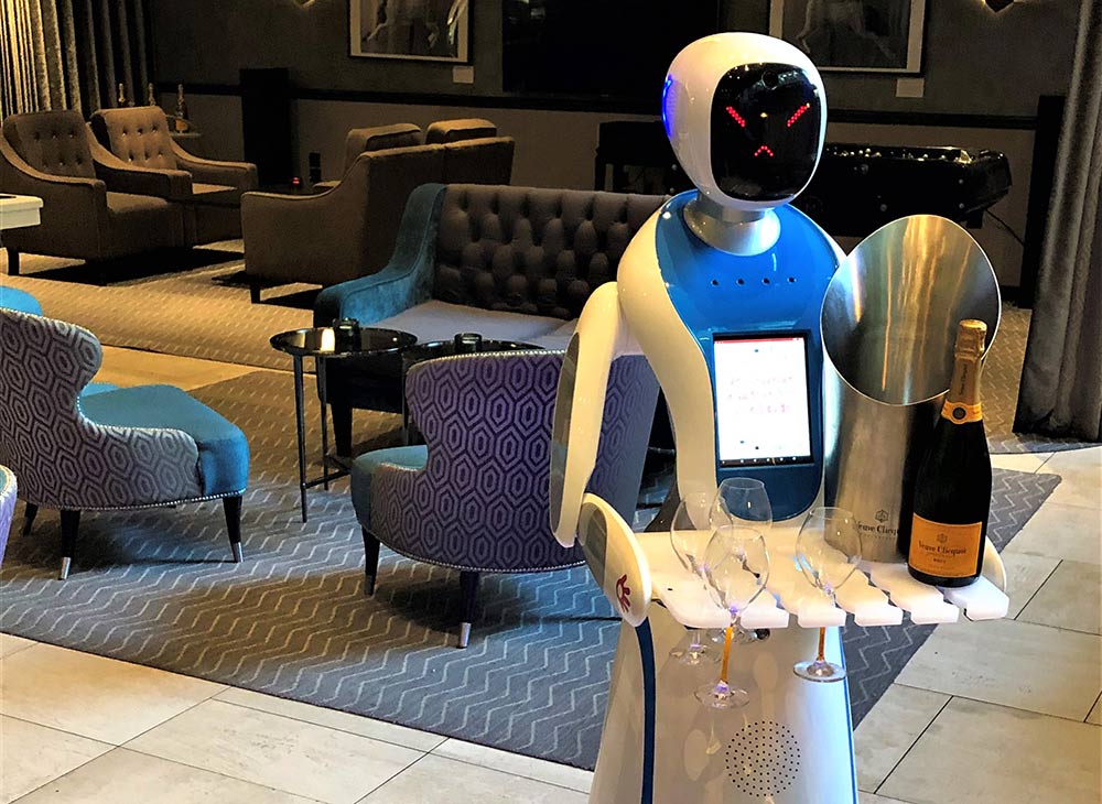 Is this the ultimate in Social distancing? Over the Christmas period, M Restaurants are introducing Champagne robots - yes those are actual robots that will serve Champagne throughout the grill restaurants. The robots - named Bailey and Sage - will take your order, trundle over to the bar and then return with a tray full of Champagne.
