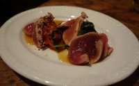 Seared pepper tuna with wild garlic green and piperade