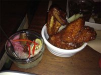 The selection of pickles and chicken wings