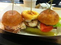 Slider sampler at the Lobster Place - three brioche rolls, one with lobster, mayo and spring onions, one with shrimp and tarragon mayo and a crab club sandwich with saffron aioli