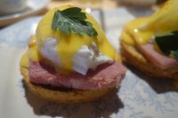 Eggs Benedict - cheese biscuit, glazed ham, hollandaise