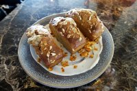 Warm honey rye cakes with raw cream 