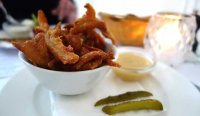 Crispy pork crackling with apple and horseradish sauce