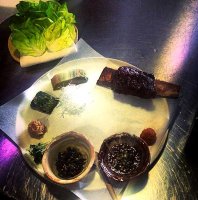 Sexter short rib served with condiments and butter lettuce at Story