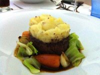 Braised beef cheek topped with horseradish mash