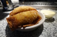 Tequenos de Aji de Gallina, Wonton fritters with traditional creamy chicken, onion, parmesan filling and amarillo chilli dip