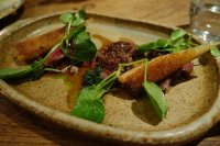 Grilled onglet with snails persillade, saldify chips and red wine sauce