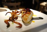 Squid stuffed with prawns and chorizo with squid ink sauce