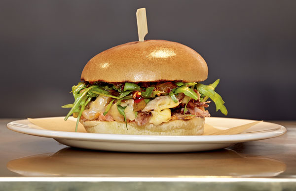 Peter Gordon launches a new menu with a duck confit burger at Gourmet Burger Kitchen