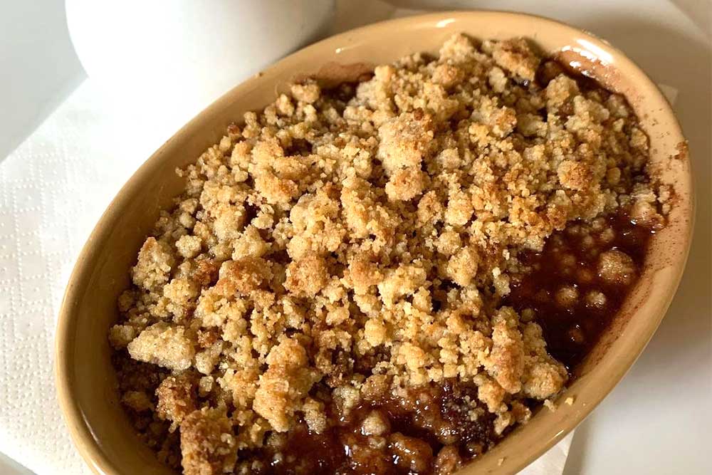 Plum & ginger crumble with custard at The Cow