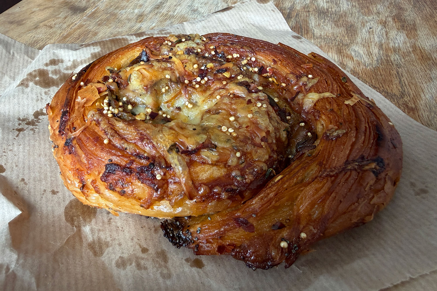 Profile Bakery (Highbury) - Tarn's roasted aubergine marinara scroll with poppy seeds, alpine meadow cheese, crispy chilli